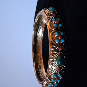 Vintage Graziano goldtone bangle bracelet with embedded stones (or faux-stones)